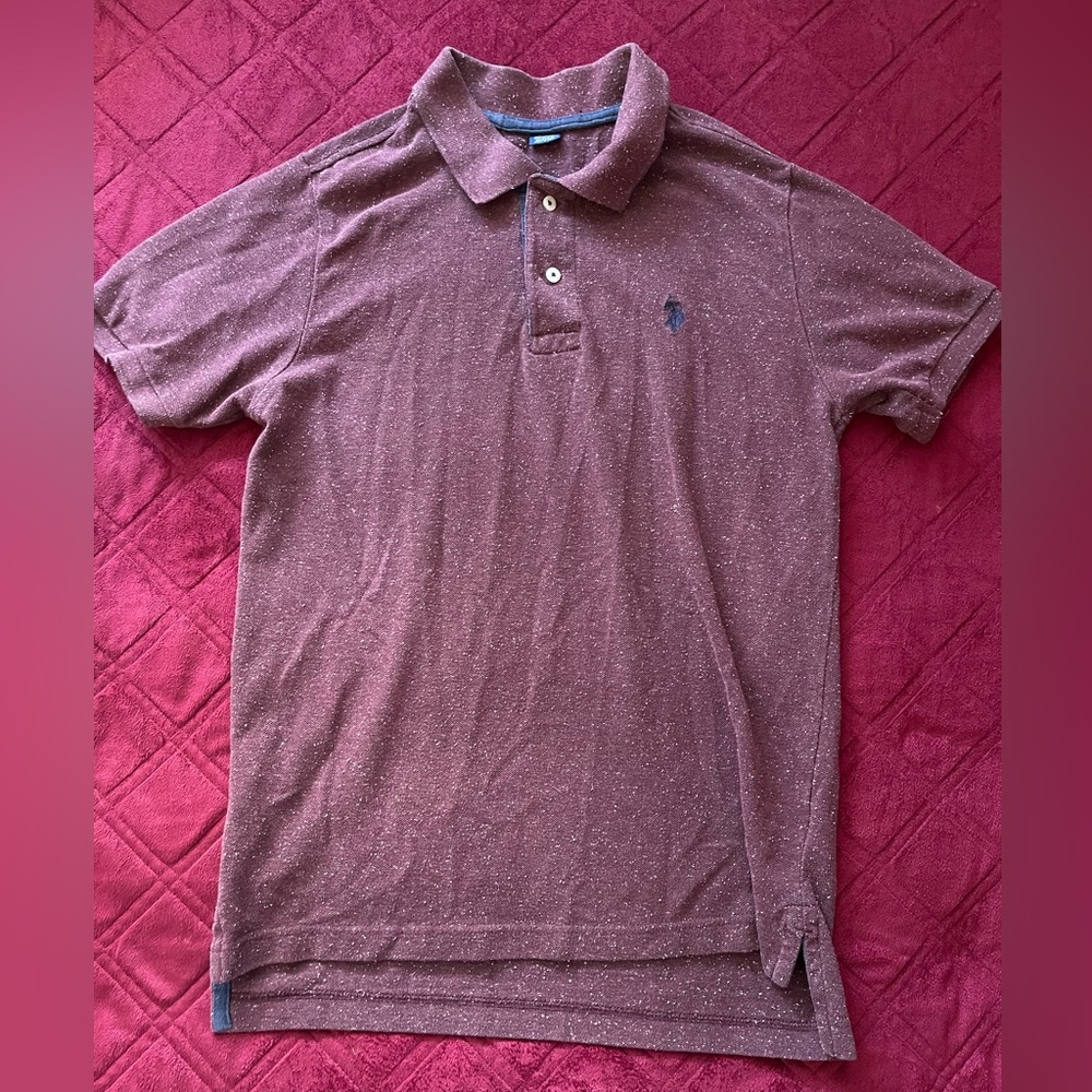 Burgundy men’s polo shirt.